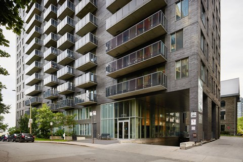 a building with balconies on the side of a street